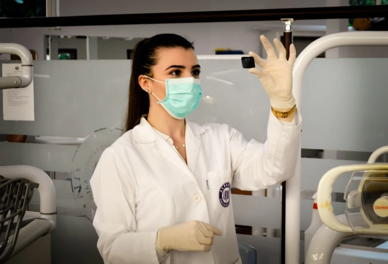 nurse holding chemical